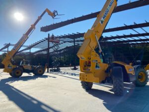 Two JCB Telehandlers rented by Hugg & Hall under the sun. 