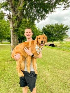 Brady with his golden retriever