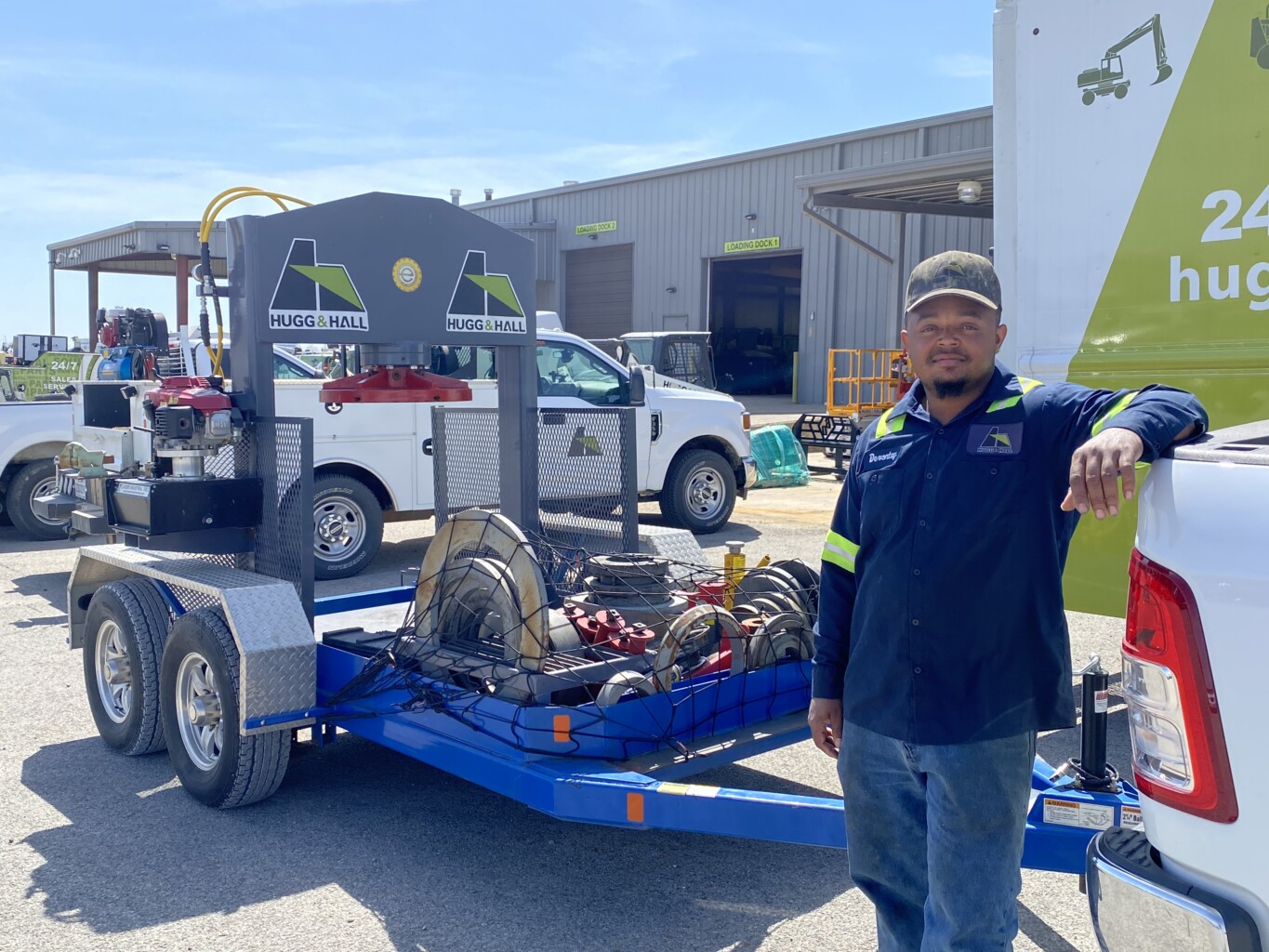 DeVontay Jones standing in front of his tire trailer. 