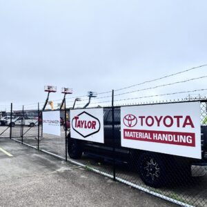 Baton Rouge Equipment Yard with Banners for Dealers: Toyota Material Handling, Taylor, Shuttlewagon